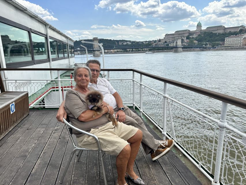 Budapest: 1 hr Sunshine Booze Cruise with Prosecco - The National Theatre and the southern riverfront