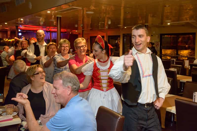 Budapest: Danube Cruise with Folk Dancing and Drinks - Parliament Building Under the Evening Lights
